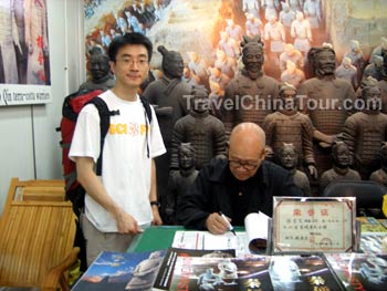 Farmer signing book.